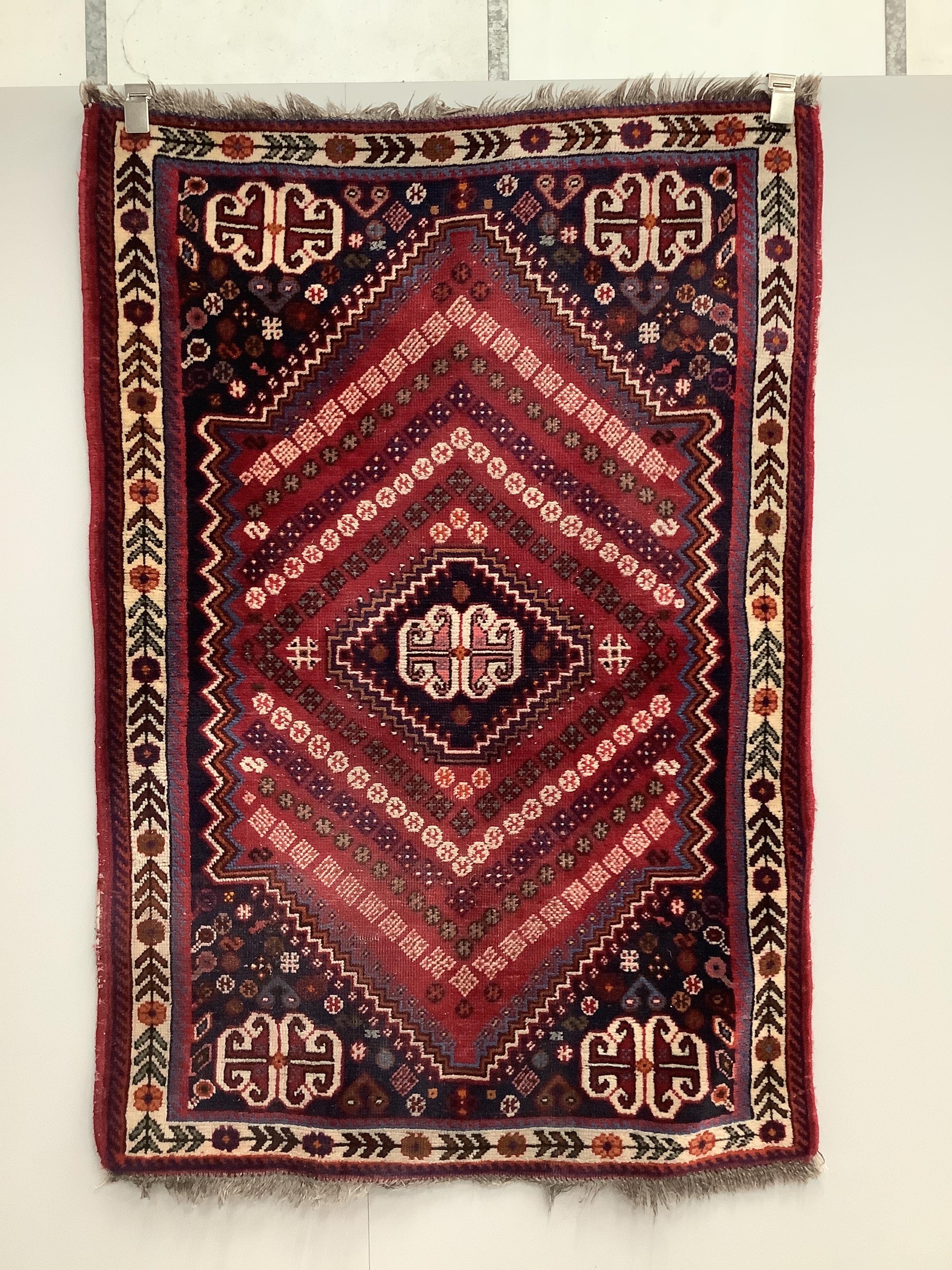 Two Persian red ground rugs, larger 148 x 102cm